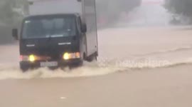 Residents struggle through flooded roads in Vietnam