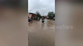 Roads submerged and buildings damaged as severe floods sweep across western Cambodia