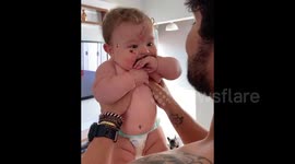 Baby boy is adorable and slightly messy after trying first acai bowl