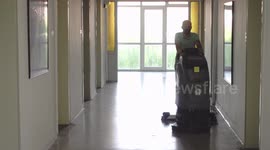 Male worker cleaning and disinfecting the school, cleaning the surfaces with disinfectant in Ankara, Turkey