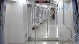 Man in medical suit disinfecting the subway with machine, sprays disinfectant on subway seats with the machine in Ankara, Turkey