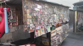 Bizarre motorcycle cart sells hundreds of stickers in Thailand