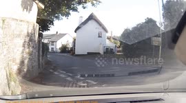Truck gets caught on wall