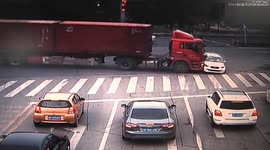 Car dragged by truck after illegal left-turn