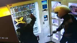 Teenagers smash vending machine in Chinese sex shop
