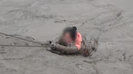 Firefighters pull teenager out of thick mud