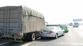 Driver captures moment truck smashes into him in China
