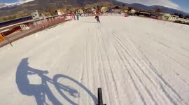 Downhill bike race through snow