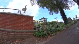 Skater jumps down big gap