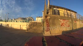 Skater jumps down huge stair set in brighton