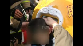 Todder's  head stuck in  rocking car