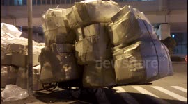 Dangerously overloaded delivery bikes in Shanghai