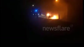 Car burns after Llandudno, Wales bank raid +SWEARING+