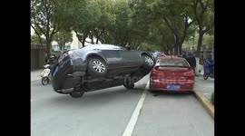 Car up-ended on parked car in China