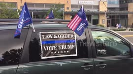 Flag-festooned convoy of Trump supporters drives through Bellevue, Washington en route to rally