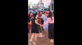 People dance in floodwaters at a wedding party in Vietnam
