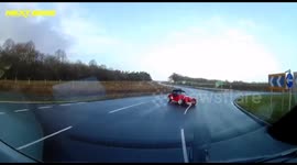 Dashcam captures moment car spin out of control on UK roundabout