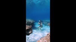 This is a sea-riously good workout! Woman manages to exercise under water
