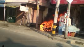 Biker Cheats death after his bike catches fire in the middle of a busy street in Northern India
