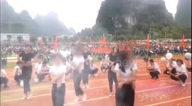 Middle school students lift up T-shirts during dance routine causing controversy in China