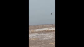 Helicopter used to rescue sailors after ship sinks due to tropical storm Linfa