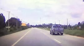 Pickup truck flips over central reservation into oncoming car on road in Thailand
