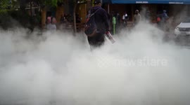 Protester uses Fire Extinguisher in Street