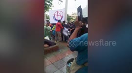 Thai protesters clash with police before royal motorcade passes through area