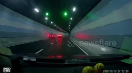 Abrupt overtaking forces car to collide with tunnel wall in Shanghai