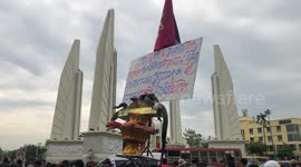 Protesters gather in Bangkok demanding reform as Thai king visits country