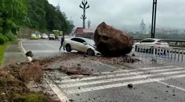 Huge boulder crushed car hood after rolling down mountain in southern China