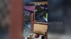 Terrifying moment house collapses as tropical storm Ofel batters the Philippines