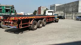 The truck driver reverse the loaded truck