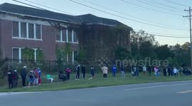 Long lines on day one of early voting in battleground state of North Carolina