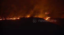 Evacuations ordered as brushfire scorches foothills south of Redlands in California