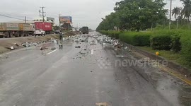 Delivery truck spills 6,000 bottles of beer after skidding on wet road