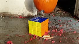 Halloween pumpkin vs giant Rubik's Cube in epic, unnecessary and glorious collision