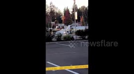 Small plane crashes in Washington parking lot