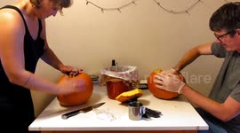 Time-lapse Video of Couple Carving Pumpkins