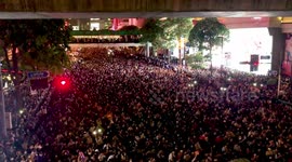 Thai demonstrators push crowd control vehicle away from anti-government protest in Bangkok