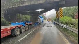 Bridge collapse narrowly misses cars after overloaded truck smashes through in China
