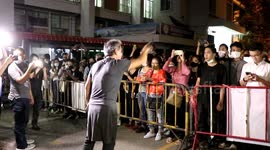 Thai protesters call for release of jailed leaders outside police station in Chiang Mai