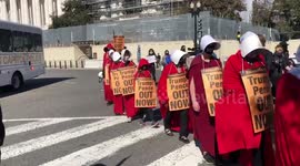 Protesters dressed as Handmaid's Tale characters protest outside Supreme Court