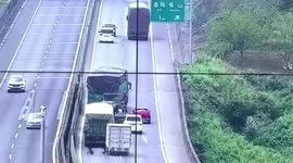 Brand-new car blocks highway after dropping off transport truck in southwestern China