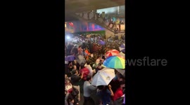 Police use water cannons to disperse protesters calling for the resignation of the prime minister in Thailand