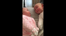 Twin sisters have adorable first chat with each other