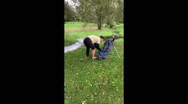 Paddling in freezing water to play a golf shot with a giant splash.