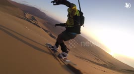 Athlete films himself sandboarding down dunes in Chilean desert