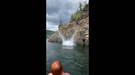 Canadian man in epic backflip fail from 50ft cliff