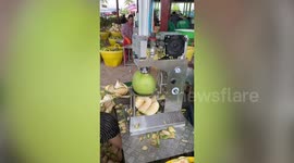 Fascinating footage shows coconut peeling procedure in Thailand